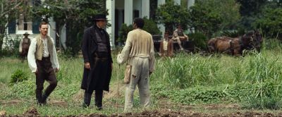 Still from 12 Years a Slave (2013) that has been tagged with: day & over-the-shoulder & horses