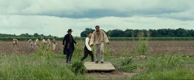 Still from 12 Years a Slave (2013) that has been tagged with: day & three-shot & exterior & field