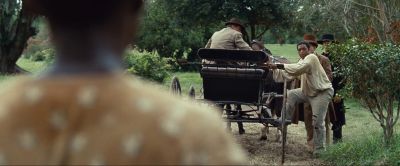 Still from 12 Years a Slave (2013) that has been tagged with: wide shot & day & climbing & exterior & group-shot