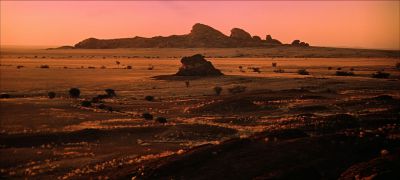 Still from 2001: A Space Odyssey (1968) that has been tagged with: 8b4513 & establishing shot & horizon & day