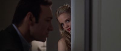 Still from American Beauty (1999) that has been tagged with: profile shot & peeking & doorway & medium close-up