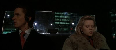 Still from American Psycho (2000) that has been tagged with: night & car interior & interior & backseat & medium wide