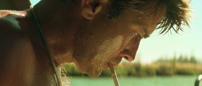 Still from Apocalypse Now (1979) that has been tagged with: smoking & profile shot & clean single