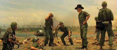 Still from Apocalypse Now (1979) that has been tagged with: wide shot & helmet & day & group-shot & exterior