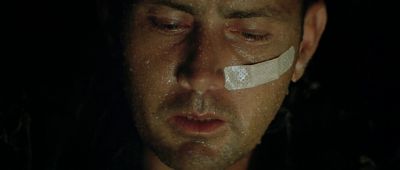 Still from Apocalypse Now (1979) that has been tagged with: bandaid & night & close-up
