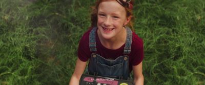 Still from Commercial: Greater Texas Credit Union — "Ava's Rocket" that has been tagged with: grass & looking up