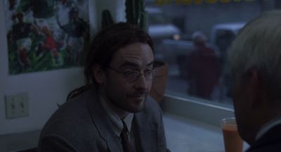 Still from Being John Malkovich (1999) that has been tagged with: interior & diner & over-the-shoulder & medium close-up & day
