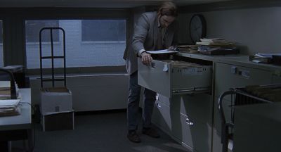Still from Being John Malkovich (1999) that has been tagged with: clean single & office & wide shot