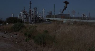 Still from Being John Malkovich (1999) that has been tagged with: clean single & wide shot & turnpike & falling & exterior