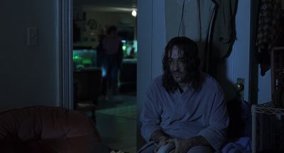 Still from Being John Malkovich (1999) that has been tagged with: interior & fish tank & medium wide & night & aquarium