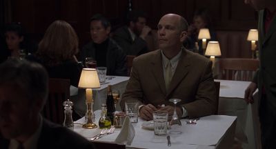 Still from Being John Malkovich (1999) that has been tagged with: restaurant & interior & practical lamp & medium wide