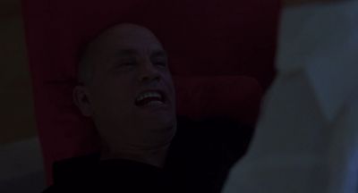 Still from Being John Malkovich (1999) that has been tagged with: night & over-the-shoulder & couch