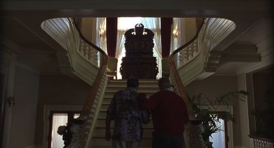 Still from Being John Malkovich (1999) that has been tagged with: over-the-shoulder & stairs & two-shot & interior & day
