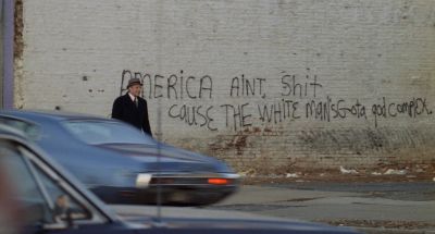 Still from Being There (1979) that has been tagged with: extreme wide & day & graffiti