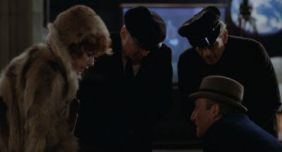 Still from Being There (1979) that has been tagged with: night & exterior & group-shot & medium shot