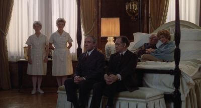 Still from Being There (1979) that has been tagged with: 2b1508 & group-shot & bedroom & practical lamp