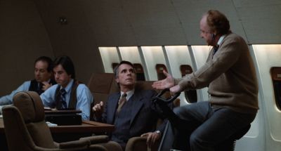 Still from Being There (1979) that has been tagged with: interior & group-shot & airplane