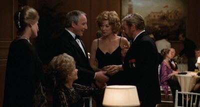 Still from Being There (1979) that has been tagged with: night & medium shot & interior & group-shot