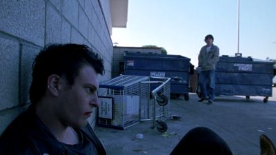Still from Brick (2005) that has been tagged with: parking lot & over-the-shoulder