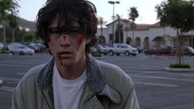Still from Brick (2005) that has been tagged with: parking lot & blood & day