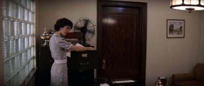 Still from Chinatown (1974) that has been tagged with: 714f38 & secretary & fan & practical lamp