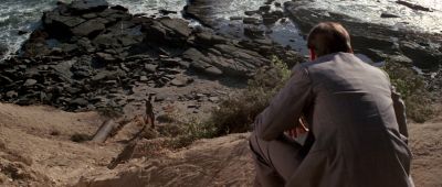Still from Chinatown (1974) that has been tagged with: squatting & looking down & beach & cliff