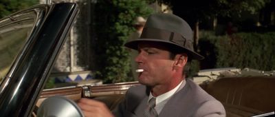 Still from Chinatown (1974) that has been tagged with: smoking & hat