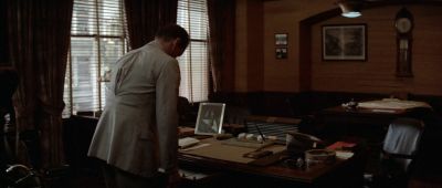 Still from Chinatown (1974) that has been tagged with: desk & blinds & office & over-the-shoulder & clean single
