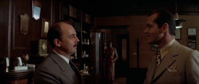 Still from Chinatown (1974) that has been tagged with: 4f404c & two-shot & medium shot & profile shot & interior