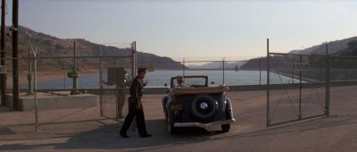 Still from Chinatown (1974) that has been tagged with: three-shot & security officer & convertable & car & day