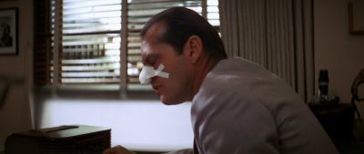 Still from Chinatown (1974) that has been tagged with: medium close-up & interior & blinds & window & profile shot