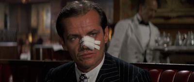 Still from Chinatown (1974) that has been tagged with: 000000 & server & medium close-up & night