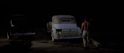 Still from Chinatown (1974) that has been tagged with: over-the-shoulder & parking lot