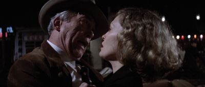Still from Chinatown (1974) that has been tagged with: 000000 & medium close-up & night & profile shot