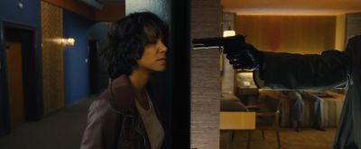 Still from Cloud Atlas (2012) that has been tagged with: e6be89 & medium shot & gun & interior & clean single