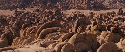Still from Django Unchained (2012) that has been tagged with: wide shot & rocks