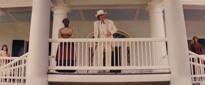 Still from Django Unchained (2012) that has been tagged with: 714f38 & two-shot & wide shot & balcony