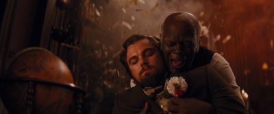 Still from Django Unchained (2012) that has been tagged with: night & gunblast & blood & interior & medium wide