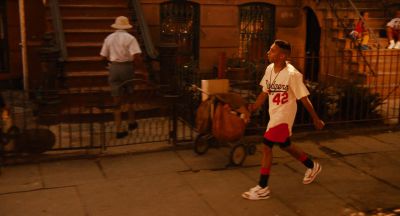 Still from Do the Right Thing (1989) that has been tagged with: day & exterior & mail man & wide shot