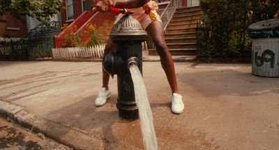 Still from Do the Right Thing (1989) that has been tagged with: medium shot & fire hydrant