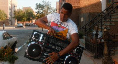 Still from Do the Right Thing (1989) that has been tagged with: medium wide & boombox & day