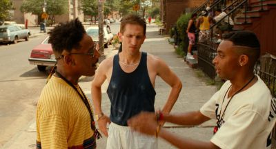 Still from Do the Right Thing (1989) that has been tagged with: 7a3f00 & three-shot & medium wide & day