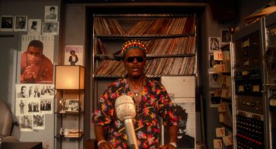Still from Do the Right Thing (1989) that has been tagged with: clean single & day & microphone & radio station & dj & medium wide