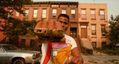 Still from Do the Right Thing (1989) that has been tagged with: street & day & medium wide & exterior