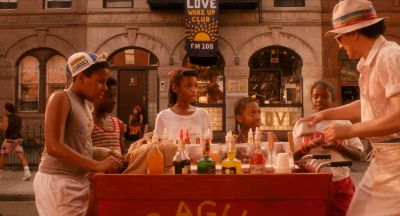 Still from Do the Right Thing (1989) that has been tagged with: group-shot & medium wide & italian ice