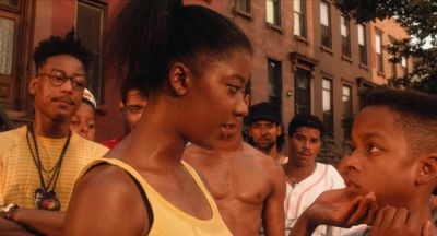 Still from Do the Right Thing (1989) that has been tagged with: f4a662 & medium close-up & clean single & day