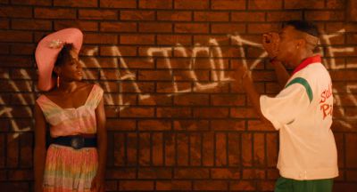 Still from Do the Right Thing (1989) that has been tagged with: two-shot & brick wall
