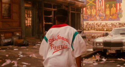 Still from Do the Right Thing (1989) that has been tagged with: clean single & burnt building & medium wide & day & exterior
