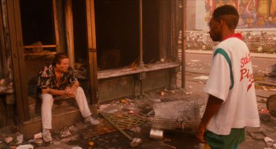 Still from Do the Right Thing (1989) that has been tagged with: burnt building & day