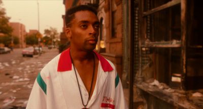 Still from Do the Right Thing (1989) that has been tagged with: burnt building & medium shot